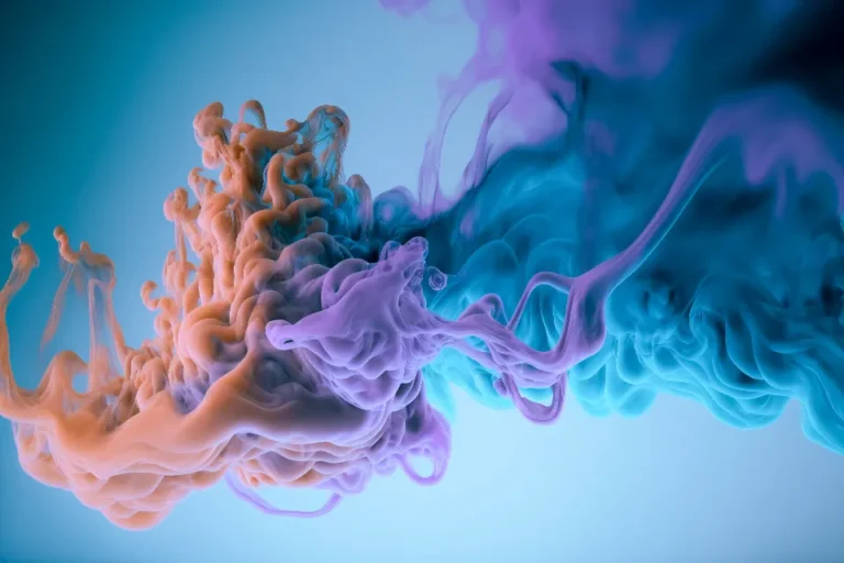 Orange and blue ink swirling in water